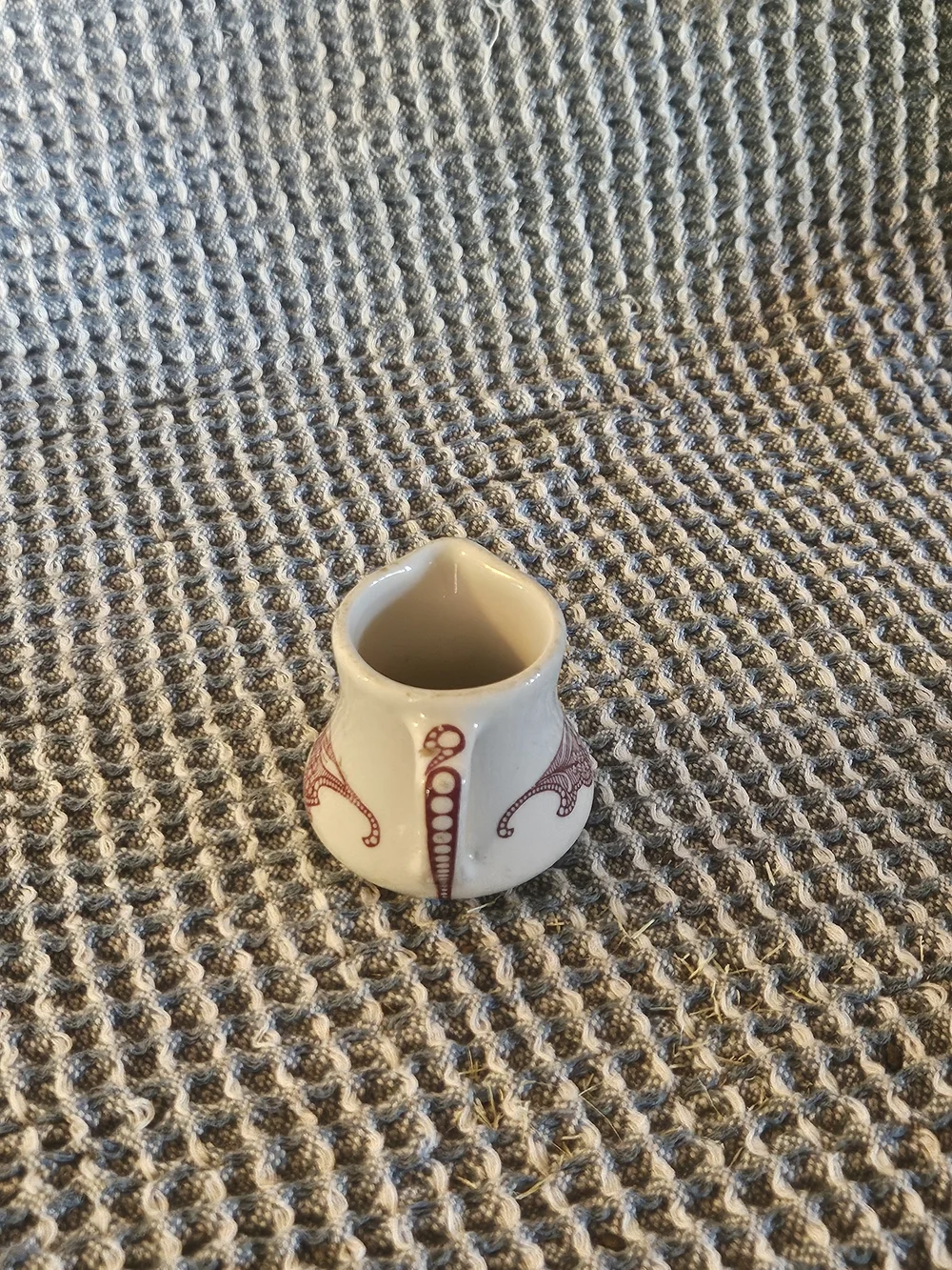 Cream Ceramic Mini Pitcher with Red Filigree Accent